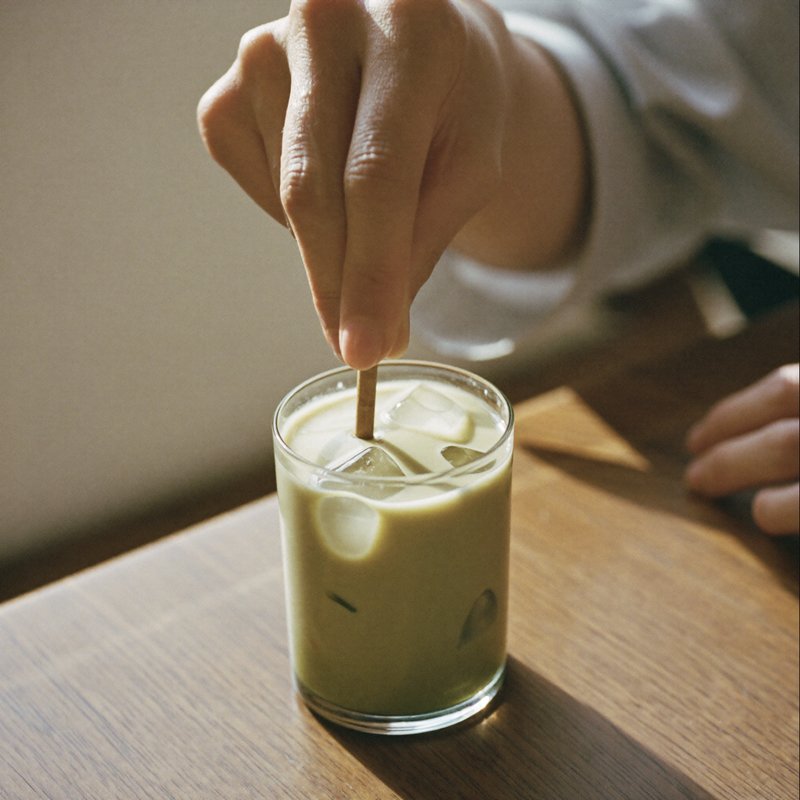 personality — hands stirring matcha